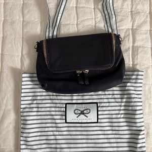 Plum Anya Hindmarch convertible crossbody.